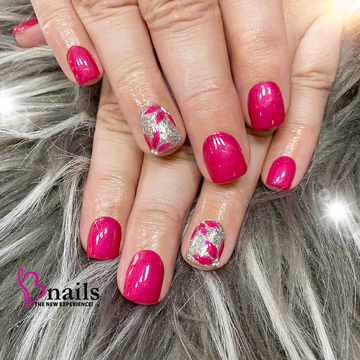 dipped nail in pink with silver nail design
