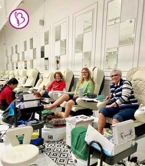 Client enjoying a soothing foot soak in plush pedicure chair