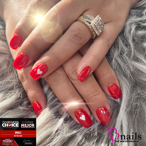 Client receiving a customized manicure blending trends and classic style