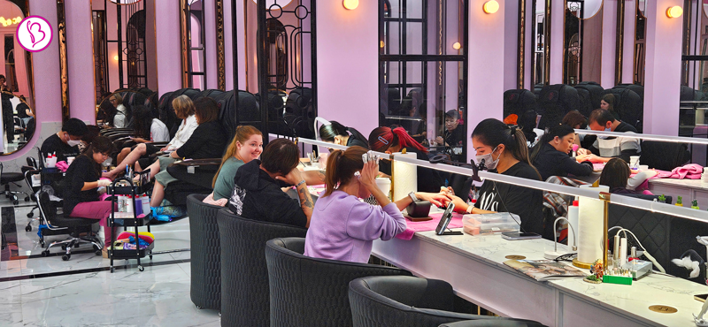 Nail technician at Bnails Cedar Park perfecting a client’s manicure in a clean, modern salon